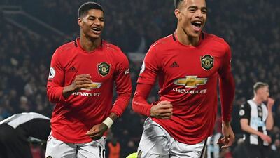 Manchester United's Mason Greenwood, right, celebrates after scoring his team's second goal on Thursday. AFP