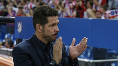 Atletico Madrid manager Diego Simeone applauds during his team’s Champions League match against Bayern Munich. Sergio Perez / Reuters
