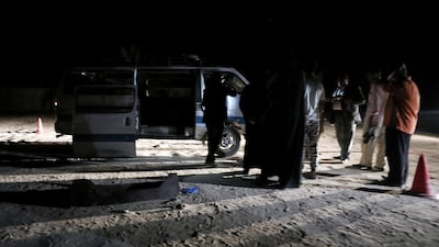 Policemen stand beside the microbus which carried the Coptic Christians when gunmen opened fire in Minya. Reuters