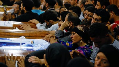 Mourners gather at the Sacred Family Church for the funeral of Coptic Christians who were killed in Minya, Egypt, on May 26, 2017. Mohamed Abd El Ghany / Reuters