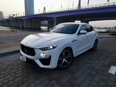A smattering of anodised blue elements hint at the car's hybrid format. Photo: Maserati