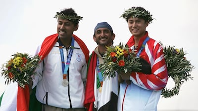 Ahmed bin Hasher Al Maktoum of the United Arab Emirates (C) won the gold medal in the men's double trap event at the Athens 2004 Olympic Games. Rajyavardhan Rathore of India won the silver medal, (L) and Zheng Wang of China (R) won bronze. Getty.