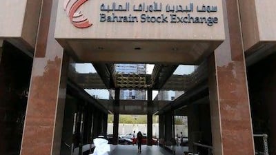 A pedestrian enters the Bahrain stock exchange in Manama, Bahrain, on Wednesday, March 24, 2010. Bahrain sold $1.25 billion of 10- year bonds, according to a person familiar with the offering. Photographer: Phil Weymouth/Bloomberg