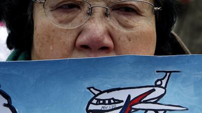 Wang Guohuand other families are still waiting for concrete information on what happened to their loved ones a year ago. Kim Kyung-Hoon / Reuters