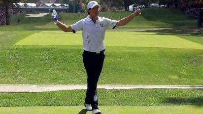 Rory McIlroy of Europe walks to the first tee after arriving late to the golf course during the Singles Matches for The 39th Ryder Cup at Medinah Country Club.