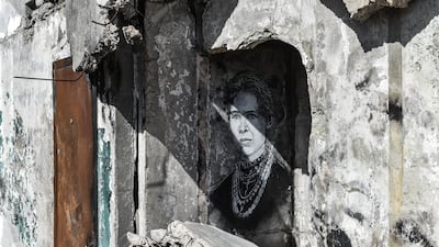 Another painting of Lesia Ukrainka, by C215, adorns a wall in Borodyanka