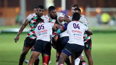Quins' Muneeb Gallant is tackled against Kandy. Chris Whiteoak / The National