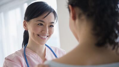 Nurse talking to patient in hospital