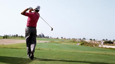 Inaugural winner Mark James of England plays his tee shot at the 16th hole during the final round of the 1989 Dubai Desert Classic. David Cannon / Getty Images / March 5, 1989
