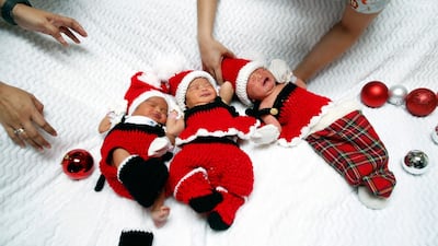 Thai nurses adjust the outfits of newborns dressed in Santa Claus costumes to celebrate the Christmas season at Paolo Memorial Hospital Chokchai 4 in Bangkok, Thailand. EPA
