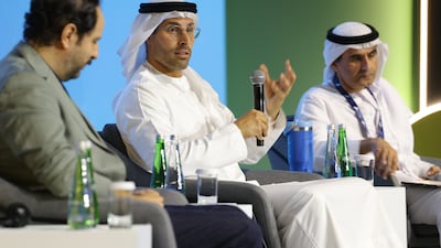 Mohamed Khalifa Al Mubarak, centre, and Ali Bin Tamim, right, during the opening session of the Congress of Arabic and Creative Industries. Photo: Abu Dhabi Arabic Language Centre