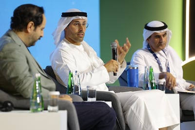 DCT Abu Dhabi chairman Mohamed Khalifa Al Mubarak, and Abu Dhabi Arabic Language Centre chairman Ali Bin Tamim, right, discuss creating new opportunities for Arabic content during the Congress of Arabic and Creative Industries. Photo: Abu Dhabi Arabic Language Centre