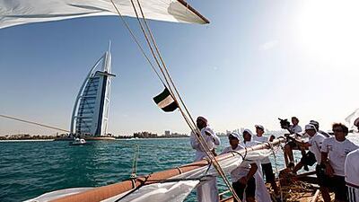 Some of the world's leading yachtsmen play second fiddle to Emirati sailors in a spectacular dhow race between two of Dubai's most famous landmarks.