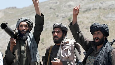 Taliban fighters react to a speech by their senior leader in the district of Shindand in Afghanistan's Herat province on May 27, 2016. Allauddin Khan, File / AP