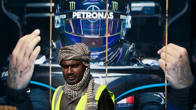 A road crew works outside the Formula One corniche circuit, in Jiddah, Saudi Arabia. The F1 race, which will take place from Dec. 3-5, will be the first time Saudi Arabia hosts the premier sporting event. AP Photo
