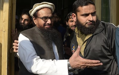 Hafiz Saeed, head of the Jamaat-ud-Dawa organisation in Pakistan and the alleged mastermind of the 2008 Mumbai attacks carried out by Pakistani terror group Lashkar-e-Taiba, arrives for Friday prayers at the Jamia Al Qadsia Masjid in Lahore following his release from house arrest on November 24, 2017. AFP