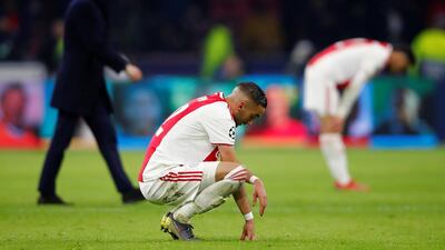 Ajax's Hakim Ziyech looks dejected with coach Erik ten Hag after the match. Reuters