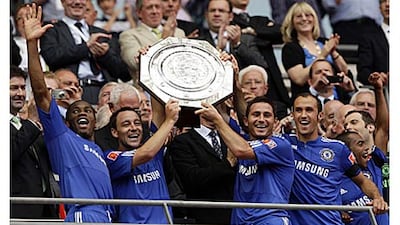 Chelsea's John Terry, left, and Frank Lampard lift the Community Shield after a 4-1 penalty shoot-out victory, following a 2-2 draw, over rivals Manchester United at Wembley.