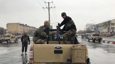 Afghan national army soldiers arrive near the Marshal Fahim military academy after a series of explosions in Kabul, Afghanistan. Mohammad Ismail / Reuters