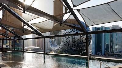 The pool at 25Hours Hotel One Central, which overlooks the Museum of the Future.