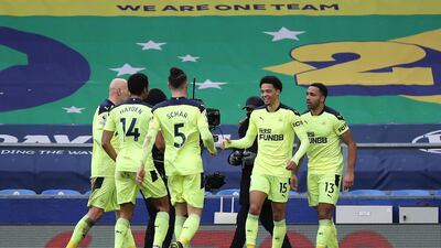 Wilson after with teammates Jonjo Shelvey, Isaac Hayden, Fabian Schar and Jamal Lewis after his second goal. Getty