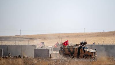 Turkish and US troops take part in their first joint patrol under a deal reached between Washington and Ankara at the border with Syria, in the Sanliurfa province of Turkey. AFP