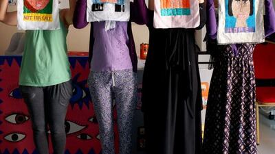 These women, victims of human trafficking, are creating artwork to exhibit in an exhibition show called Silent Voices. Delores Johnson / The National