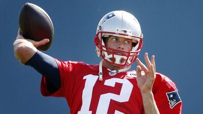 New England Patriots quarterback Tom Brady passes during an NFL training camp in Foxborough, Massachusetts on Saturday. Michael Dwyer / AP / August 1, 2015
