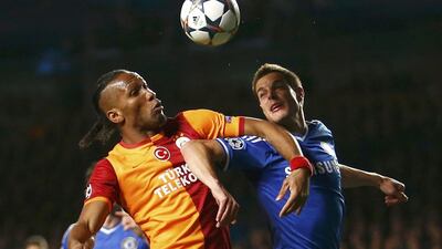 Chelsea's Cesar Azpilicueta challenges Galatasaray's Didier Drogba during their Champions League match on Tuesday. Andrew Winning / Reuters / March 18, 2014