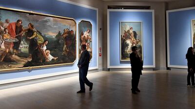 People visit the exhibition 'Tiepolo, Venice, Milan, Europe' at the Gallerie d'Italia in Milan, as coronavirus-related restrictions in most parts of Italy are eased from April 26, 2021. EPA