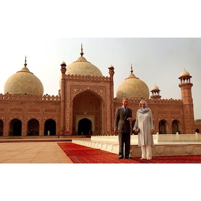 Camilla, Duchess of Cornwall and Prince Charles, Prince of Wales pose for a photograph in front of Badshai Mosque in Lahore. Instagram / Kensington Royal via Royal Collection Trust