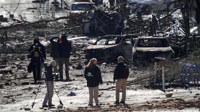 Investigators work near the site of an explosion on 2nd Avenue that occurred the day before in Nashville, Tennessee, U.S. REUTERS