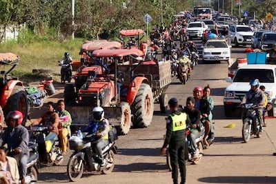 People flee an area of Cambodia's Oddar Meanchey province after attacks by the Thai military on Monday. EPA