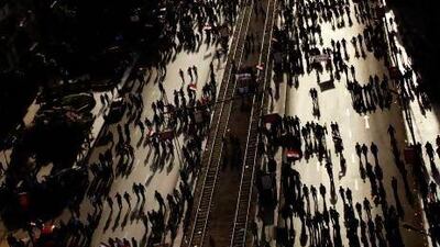 Opponents of Mr Morsi gather outside the presidential palace in Cairo.