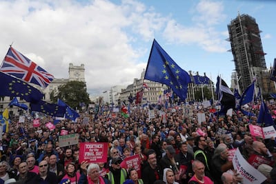 Demonstrators with placards and EU and Union flags gather in Parliament Square in central London. AFP