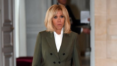 Brigitte, wearing a khaki Louis Vuitton blazer, visits the Chateau de Versailles on November 11, 2018. AFP