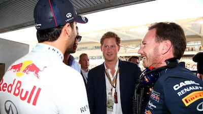 Britain's Prince Harry speaks with Red Bull Racing's Daniel Ricciardo and team principal Christian Horner in the team garage before the Abu Dhabi Grand Prix. Mark Thompson / Getty Images