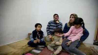 Adel Ismael with his wife and their three children, Yusif, left, Ameen, centre, and Mariam, in their home in Sahnaiya, Damascus.
