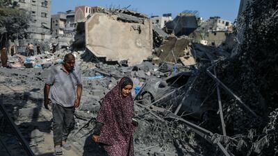 At least 13 members of the Shawa family were killed while eight others were still missing after an Israeli air strike destroyed their home. EPA