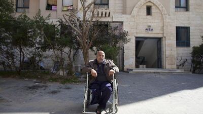 Nahed Abu Safi, 50, outside his apartment in Sheikh Zayed City. He was injured and lost his leg in 2004 during an Israeli military attack. Unable to work, the family depends on their son Salah who takes his donkey and cart each morning to the market in Jabalya to sell vegetables. Heidi Levine for The National