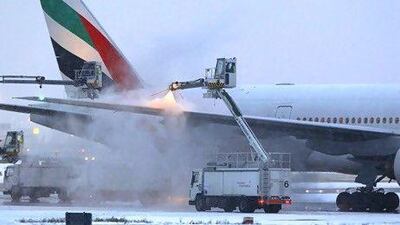 Emirates Airline says there are no seats available for some of the destinations it services over the the Christmas season. Above, an Emirates aircraft is de-iced after heavy snowfall at Dusseldorf airport in Germany. Ina Fassbender / Reuters