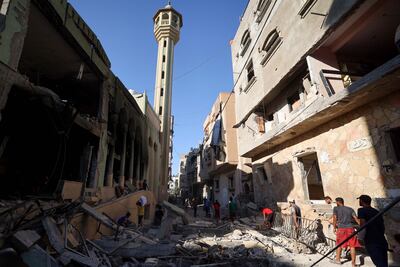 Palestinians inspect the damage from an Israeli strike at Taymiyyah mosque in Deir Al Balah in the central Gaza Strip on Wednesday. AFP