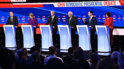 From left to right: Democratic presidential hopefuls Tom Steyer, Elizabeth Warren, Joe Biden, Bernie Sanders, Pete Buttigieg and Amy Klobuchar participate in the seventh Democratic primary debate in Des Moines, Iowa. AFP