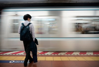 A man stands on a platform at a subway station in Tokyo. Japan’s capital is a world beater when it comes to good order. EPA