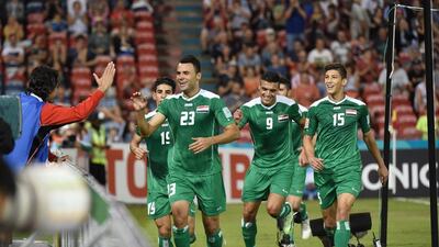 Waleed Salim Al-Lami, No 23, celebrates after equalising for Iraq. Saaed Khan / AFP