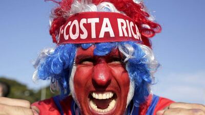 A supporter celebrates Costa Rica's classification at the end of the World Cup group D match against England, at the Mineirao Stadium, in Belo Horizonte, Brazil, Tuesday, June 24, 2014. Costa Rica finished first in what many considered the World Cup's toughest group after a dour 0-0 draw against England. AP Photo/Bruno Magalhaes