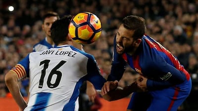 Espanyol’s Javi Lopez and Barcelona’s Jordi Alba compete for the ball. Albert Gea / Reuters