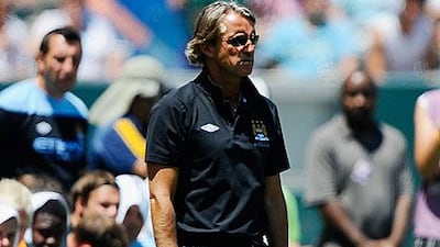 Roberto Mancini withdrew Mario Balotelli immediately following his showboating.