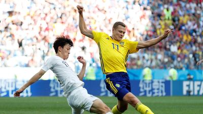 Sweden's Viktor Claesson in action with South Korea's Lee Jae-sung. Matthew Childs / Reuters
