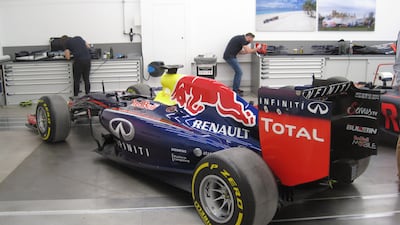 Previous years' cars in the workshop for the team's heritage programme. Photo: Daniel Bardsley for The National